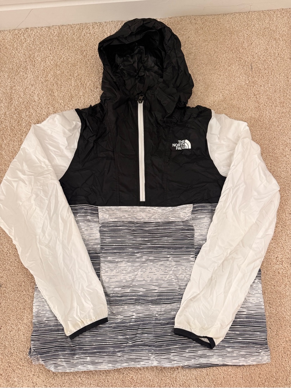 The North Face Black & White Striped Fanorak anorak jacket.